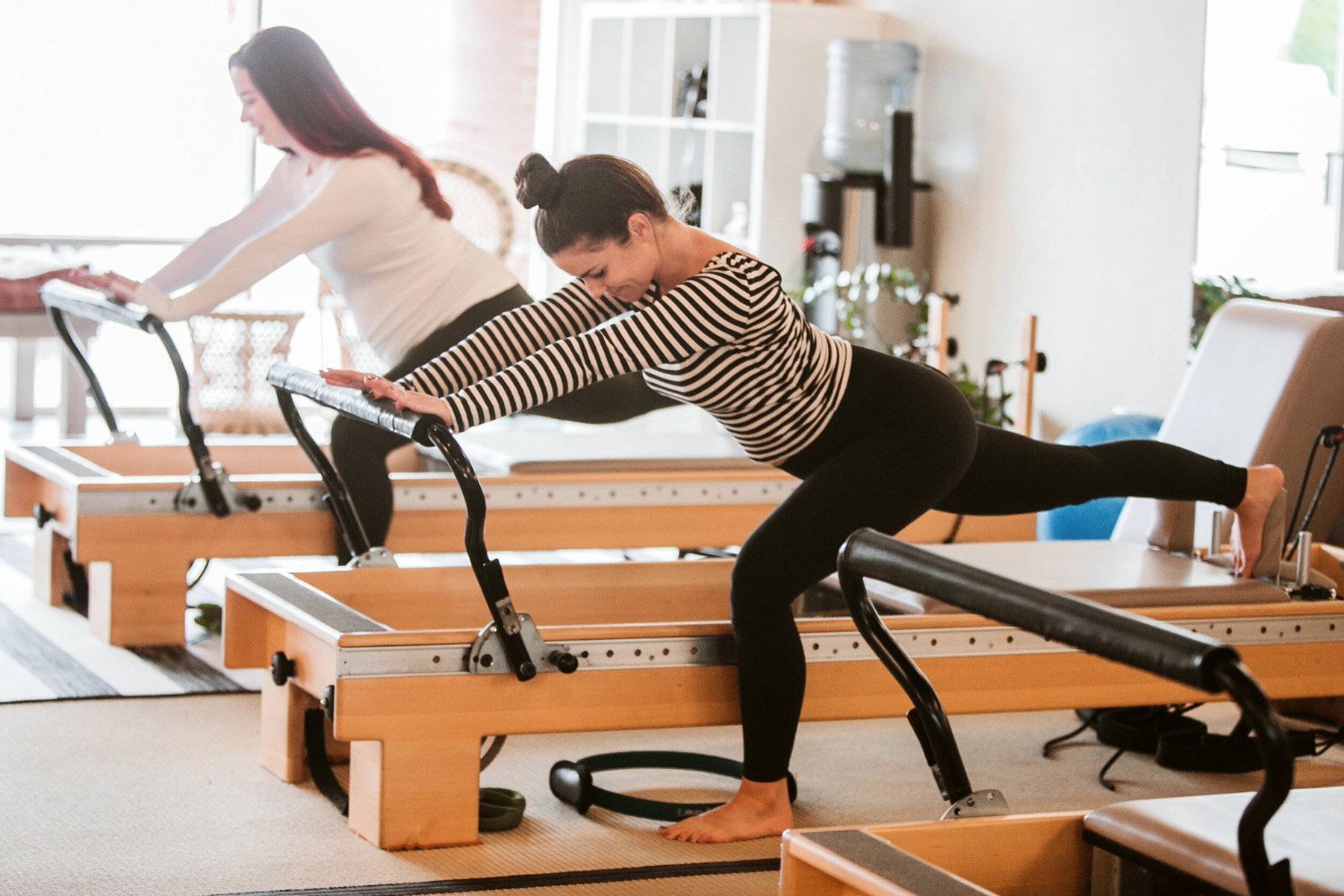 Clients lunging on the reformer
